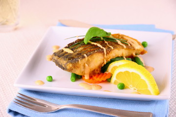 Fried carp fish fillet with vegetables
