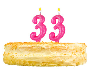 birthday cake with candles number thirty three isolated on white