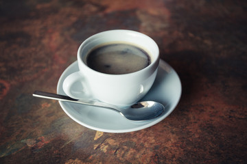 Cup of coffee on rustic table