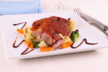 Roasted duck breast, vegetables, black sauce