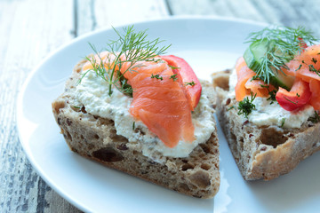 Bread with salmon and fresh green fennel for breakfast