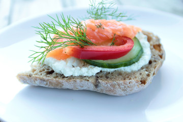 Sandwich with salmon, cream cheese, red pepper and cucumber