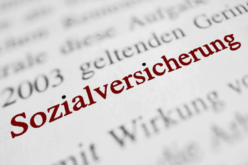Obraz premium Ubezpieczenie społeczne - czcionka czerwona