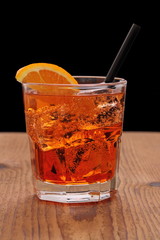 Spritz aperitif - orange cocktail with ice cubes