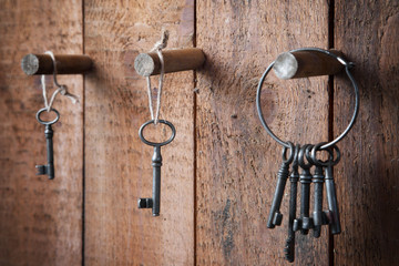Keys hanging on wooden wall