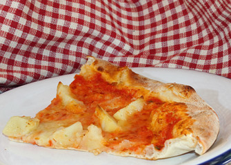 pizza with mozzarella and tomato and roast potatoes at Italian r