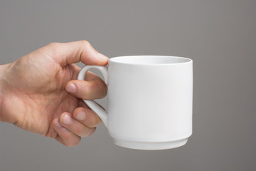 White big cup in a  hand
