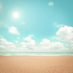 Sand beach, clouds and blue sky - retro color effect