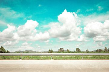 Roadside view with clouds & sky - retro lighting effect