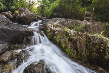 Fototapeta na wymiar Tropical rainforest landscape with beautiful waterfall