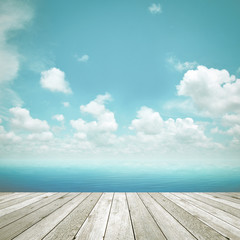 Wood plank as a pier on blue sky background - retro style