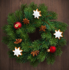 Green Christmas wreath with cookies and decorations, close-up