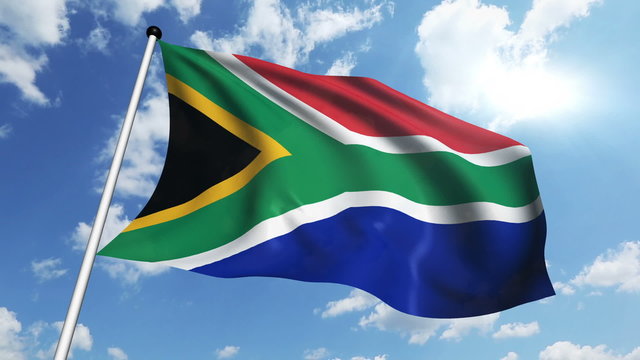 flag of South Africa with fabric structure against a cloudy sky