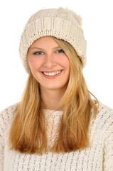 Young attractive girl with woolen hat in the studio .