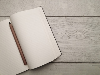 Blank textbook on a wooden table