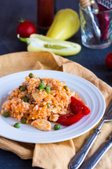 Risotto with chicken, peas and tomatoes, Italian food