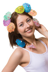 Portrait of happy woman with umbrella for drinks on her head.