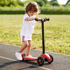 beautiful girl riding scooter at stadium © Aliaksei Lasevich