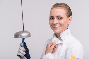 Young woman engaging in fencing