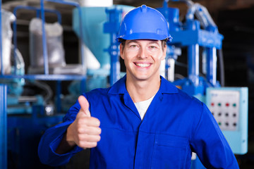 factory worker giving thumb up