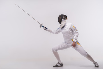Young woman engaging in fencing