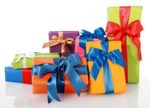 Assorted Colored Presents with Ribbons on White