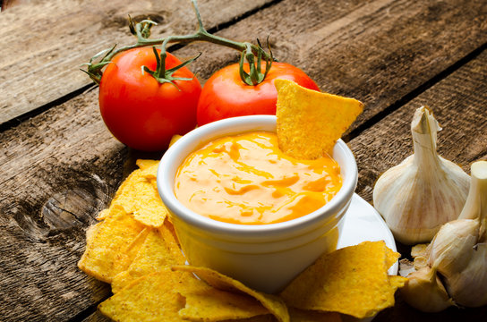 Tortilla chips with tomato and cheese-garlic dip