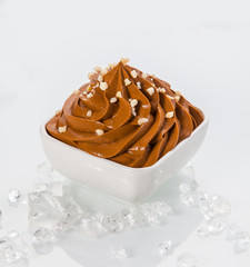 Brown Frozen Yogurt on Bowl with Little Toppings