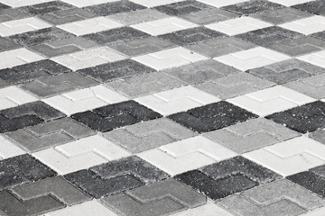 Black gray and white pattern of urban roadside pavement