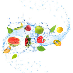 Fresh fruit, vegetables and green leaves with water splash,