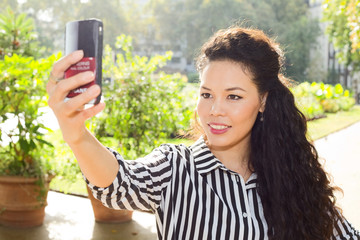 young woman taking a selfie.