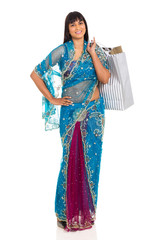 indian woman in saree carrying shopping bags