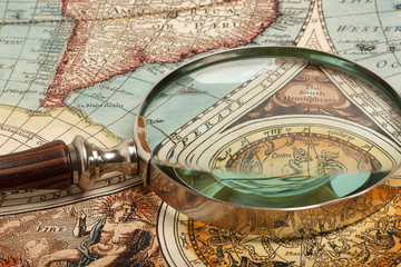 Obraz na płótnie Canvas Magnifying glass and map