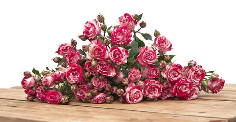 bouquet of roses on wooden table