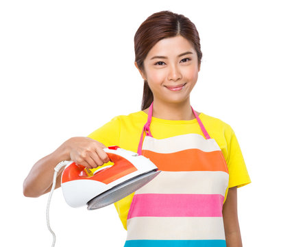 Asian housewife hold iron