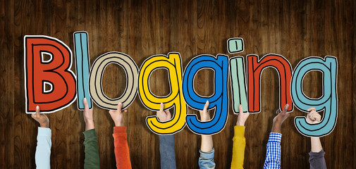 Group of Hands Holding Blogging Words