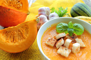 Pumpkin soup with fresh basil and croutons
