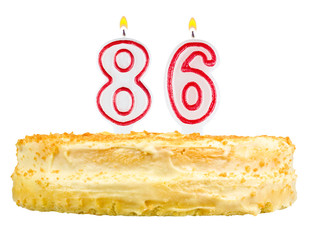 birthday cake with candles number eighty six isolated on white