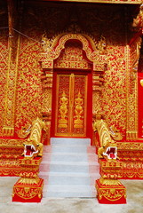horse carriage and  temple Phrathat Lampang Luang in Lampang, Th
