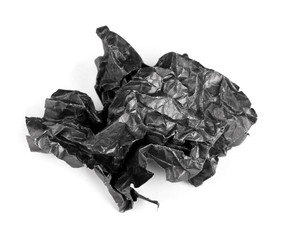 Screwed up piece of black paper