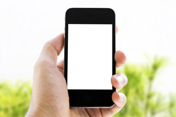 hand holding phone on nature background