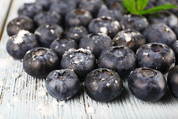 Blueberries on wooden background closeup