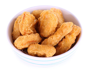 Fried chicken nuggets in bowl isolated on white