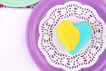 Delicious colorful mini cake  on bright background