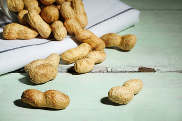 Peanuts on wooden background