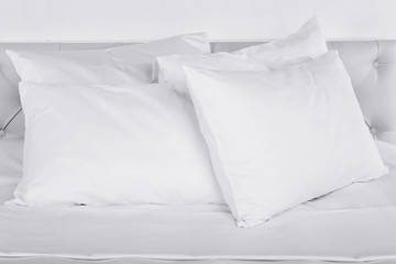 White pillows on bed in room