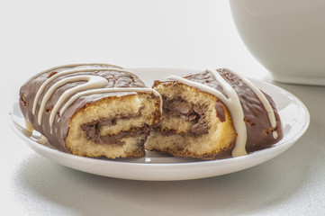 Chocolate Swiss roll closeup isolated on a white background