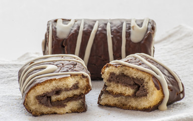 Chocolate Swiss roll closeup isolated on a white background