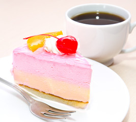 Piece of cream cake with cherry