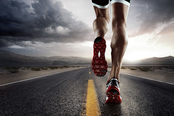 Sports background. Runner feet running on road closeup on shoe. - obrazy, fototapety, plakaty